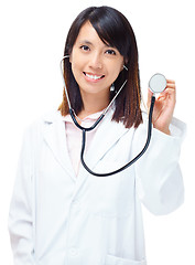 Image showing Asian medical doctor holding stethoscope