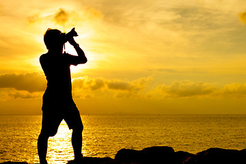 Image showing Silhouette of photographer at sunset