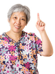 Image showing Asian old woman pointing up