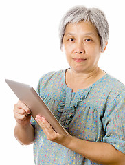 Image showing Asian old woman using tablet