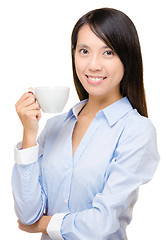 Image showing Asian business woman holding a cup of coffee