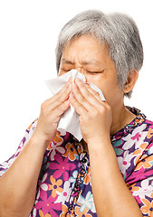 Image showing Sneezing mature asian woman