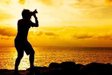 Image showing Silhouette of photographer at sunset