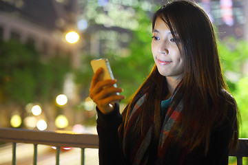 Image showing woman use mobile phone in city at night