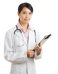 Image showing young female doctor with patient file chart