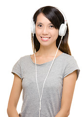 Image showing Asian woman using headphone