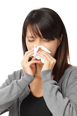 Image showing Cold sneezing asian woman