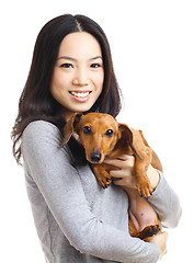 Image showing Asian woman with dachshund dog