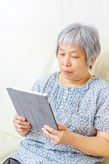 Image showing Asian old woman using tablet
