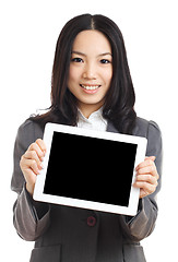 Image showing Asian business woman hold tablet , focus on tablet