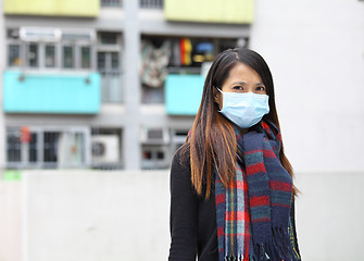 Image showing woman wearing protective face mask on street