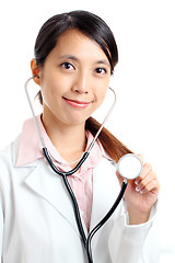 Image showing Asian medical doctor holding stethoscope