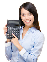 Image showing Asian woman press the calculator 