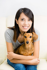 Image showing Asian woman and dachshund dog