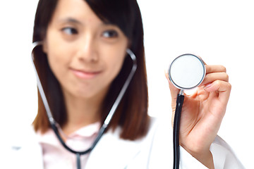 Image showing Asian female doctor holding stethoscope