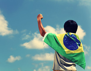 Image showing Excited man holding a brazil flag