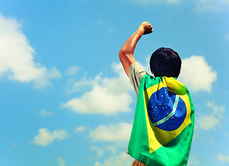 Image showing Excited man holding a brazil flag