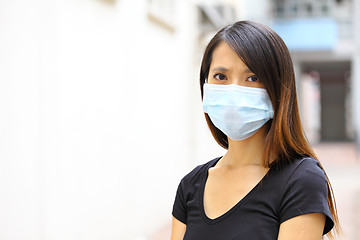 Image showing woman wearing protective face mask on street