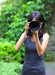 Image showing Asian woman taking photo