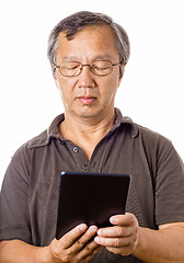 Image showing Asian man using tablet
