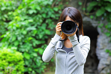 Image showing Asian woman taking photo