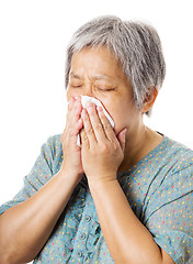 Image showing Sneezing mature asian woman