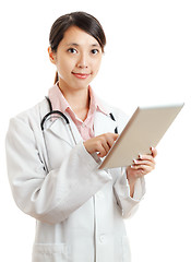 Image showing Asian female doctor with digital tablet