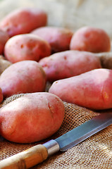 Image showing Potatoes of red peel and knife