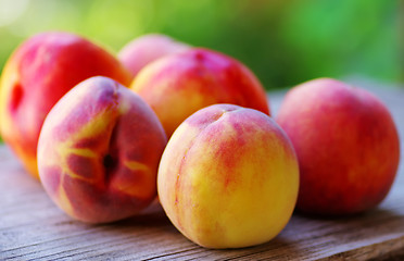 Image showing  Ripe peaches on wooden table 