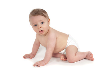 Image showing Side view of beautiful crawling baby