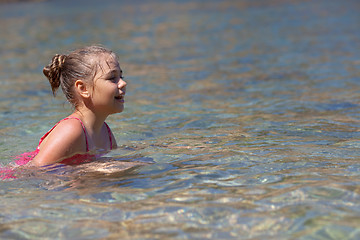 Image showing Little girl in the sea