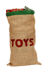 Image showing Hessian toy sack stuffed full with Christmas presents