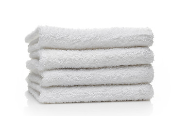 Image showing Stack of white hotel towels on a white background