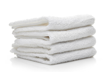 Image showing Stack of white hotel towels on a white background