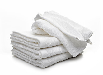 Image showing Stack of white hotel towels on a white background