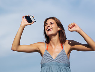 Image showing beautiful woman with mobile h