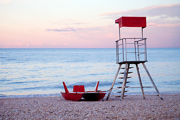 Image showing abandoned lifeguard tower and boat 