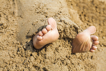 Image showing Child's feet in the sand