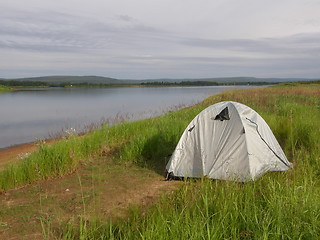 Image showing Camping tent at the bank of a river