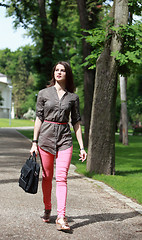 Image showing Young Woman Walking in a Park