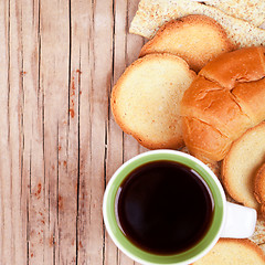 Image showing cup of coffee, crackers and fresh croissant 