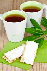 Image showing tea and crackers with cream cheese