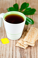 Image showing cup of tea and cereal crackers 