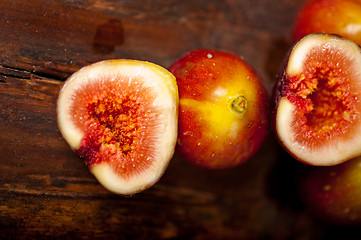 Image showing fresh figs over old wood