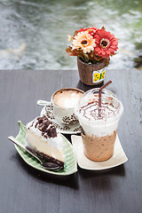 Image showing Coffee latte and cheese cake in zen garden