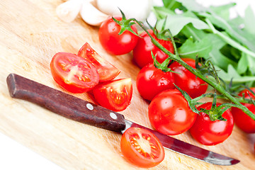 Image showing fresh tomatoes, garlic and old knife