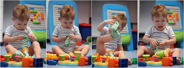 Image showing A funny baby boy trying to dress socks