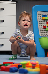 Image showing A baby boy crying in children's room