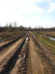 Image showing Rural road with dirt and greater traces of cars