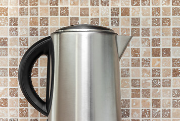 Image showing Electric kettle on kitchen tile background